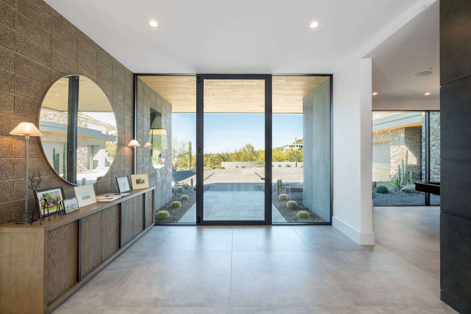 Awake Window & Door’s 505 Series hinged entry door with glass sidelights creates an open and airy entry
