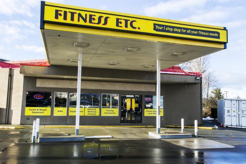  Exterior of a Fitness Etc supplement and fitness store with yellow sign