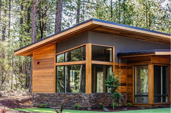 Modern wood home with expansive corner energy-efficient windows