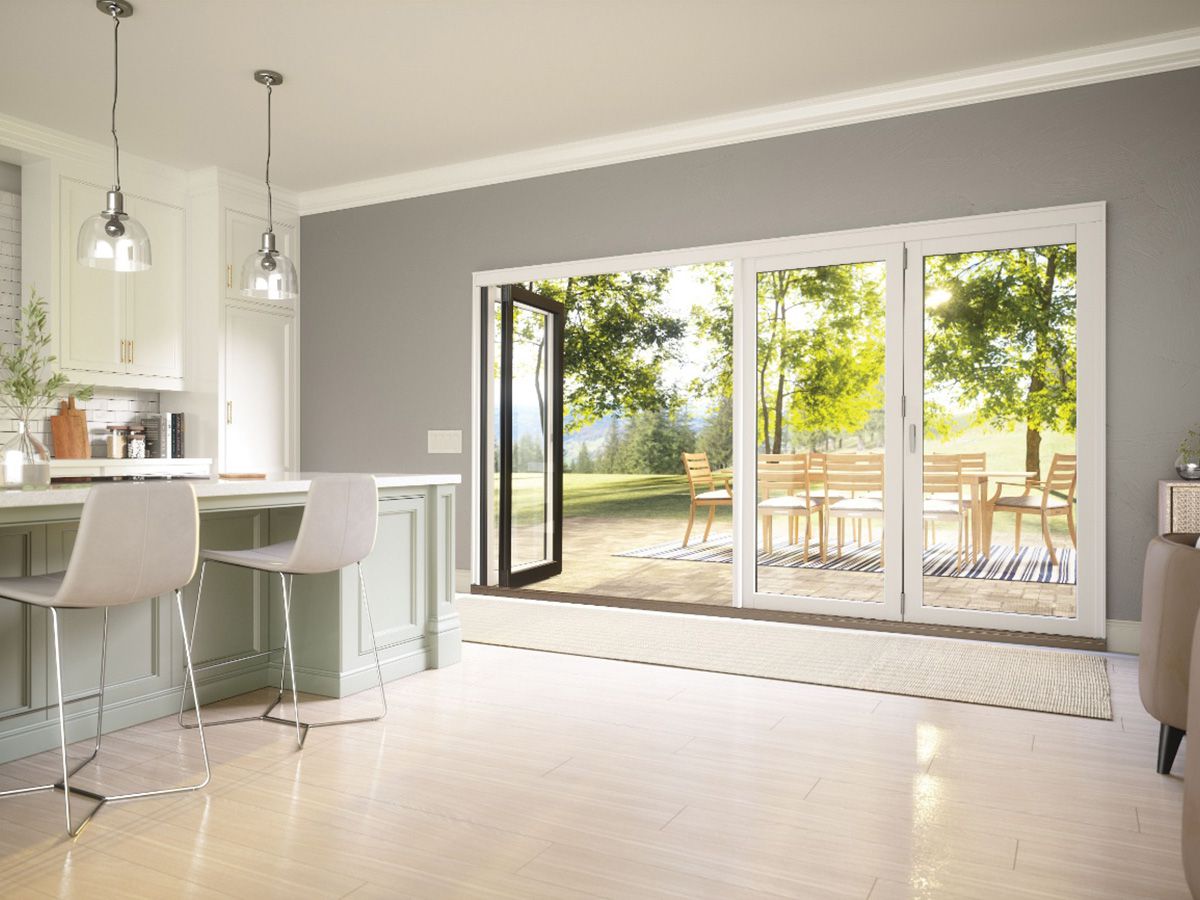 Marvin Elevate bi-folding patio doors with fiberglass exterior and rich wood interior
