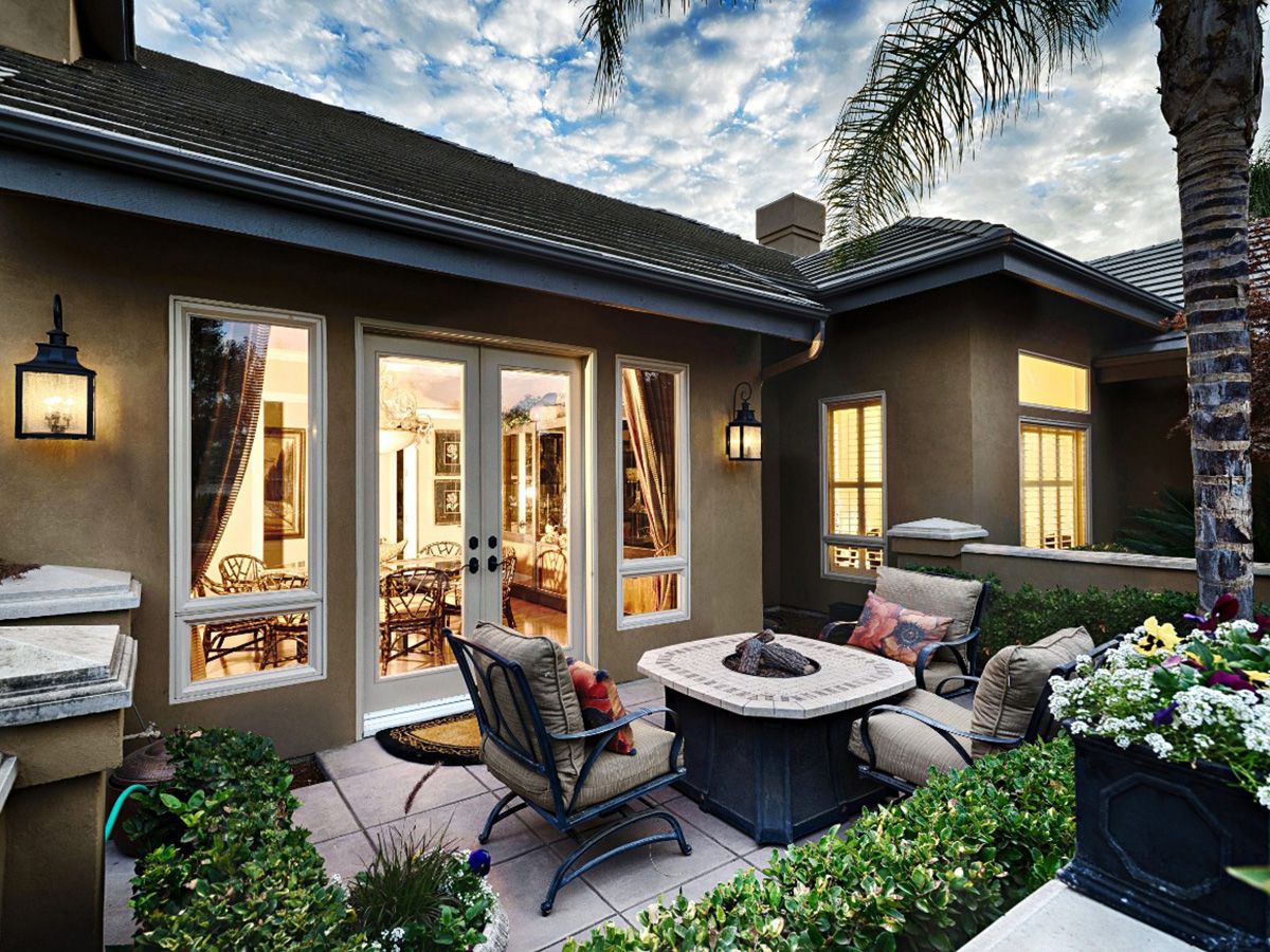 French doors by Anlin Windows and Doors allow views of cute patio sitting area maximizing views