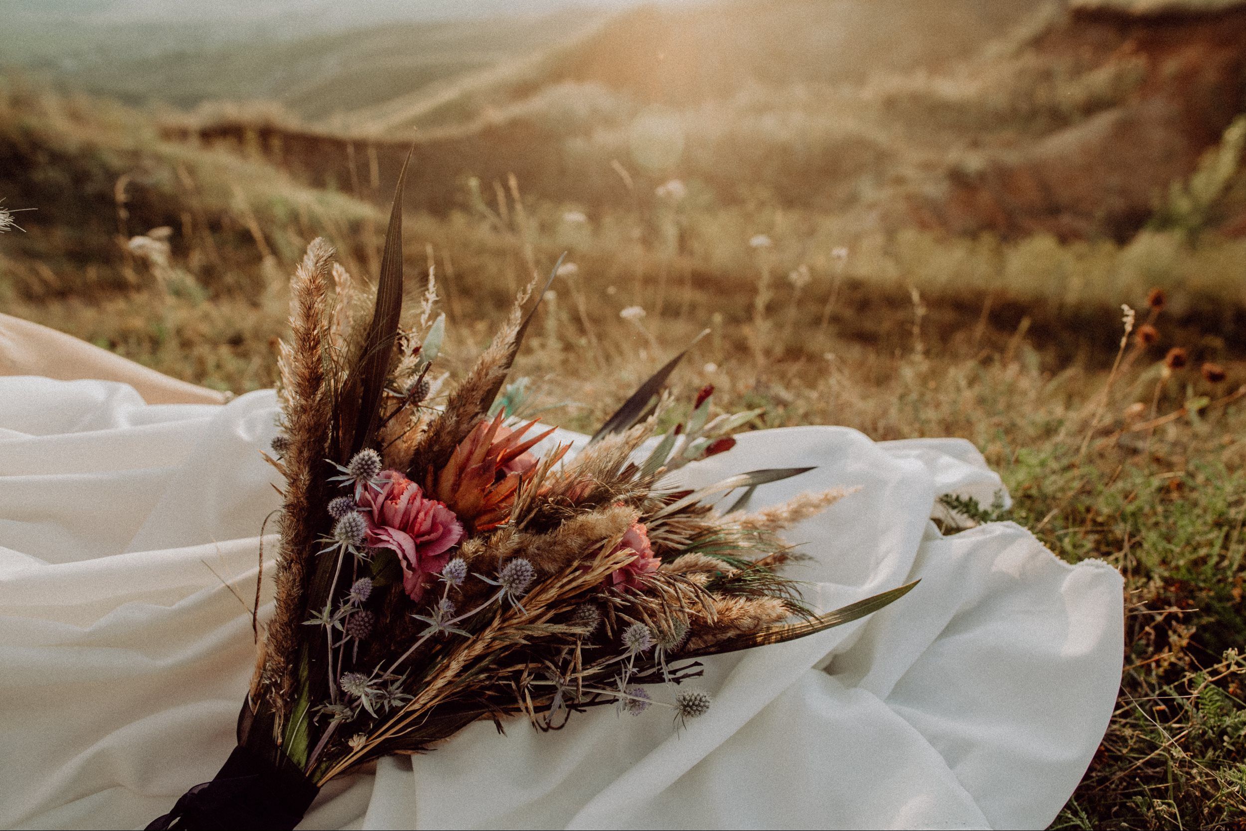 Wedding dress in a field with autumn bouqet - PA wedding fully coordinated and planned with Weddings & Events by K'Mich