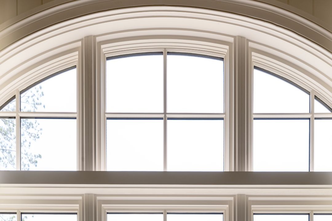 Close view of round-top specialty windows from the Marvin Ultimate collection