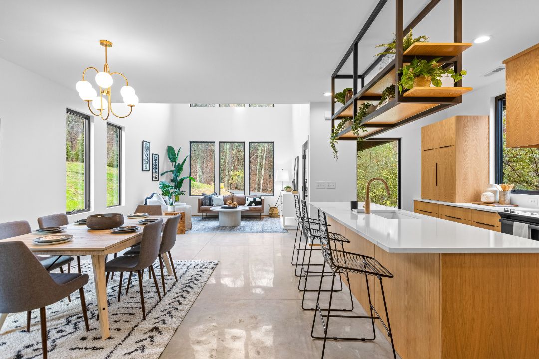 Marvin Essential casement and direct glaze picture windows maximizing natural light and views in open concept living space