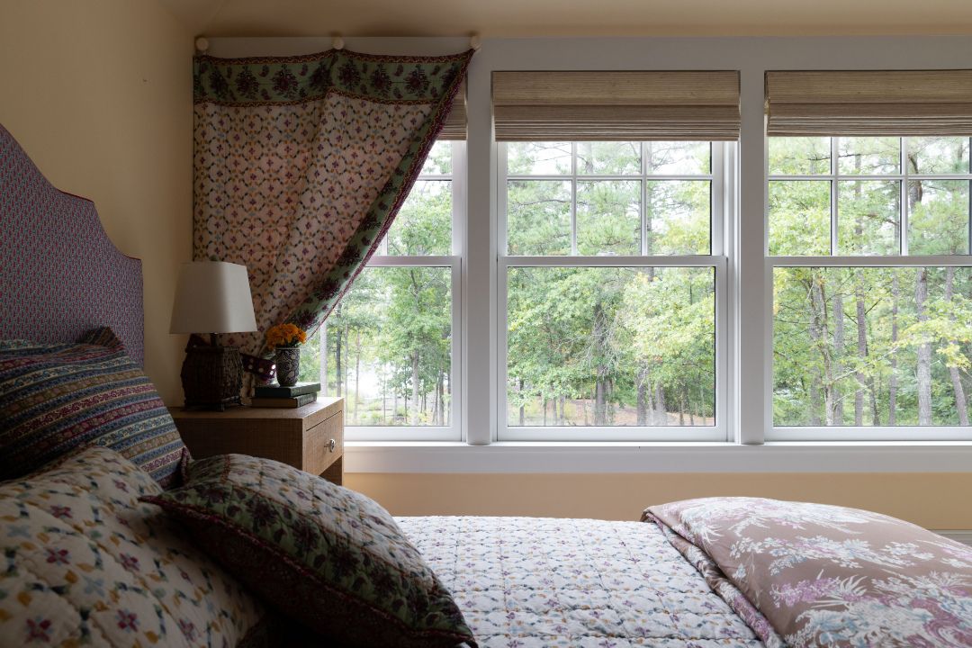 Marvin Ultimate double hung windows with primed pine wood interior trim in cozy bedroom retreat