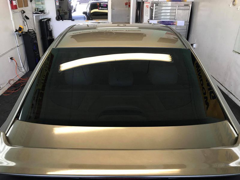 gold car with tinted glass