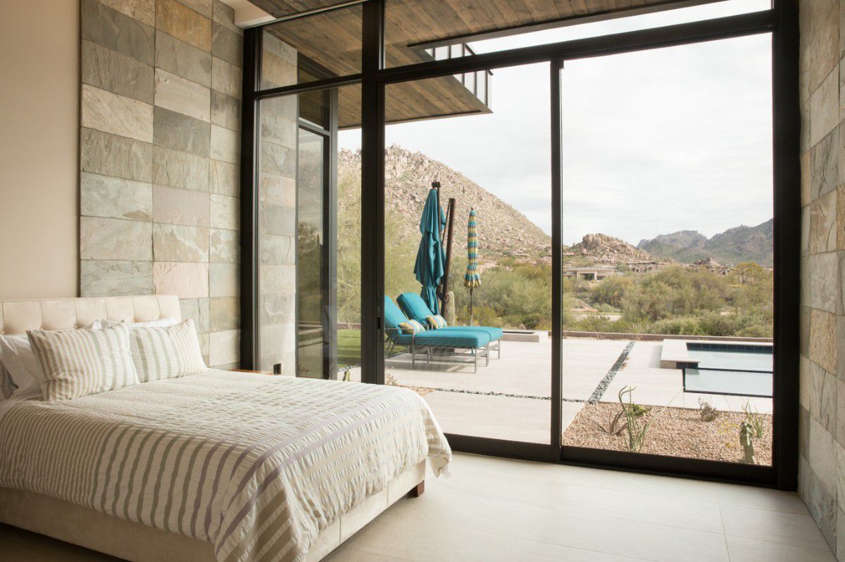 Western Architectural Openings sliding glass door system with expansive glass panels in a modern home