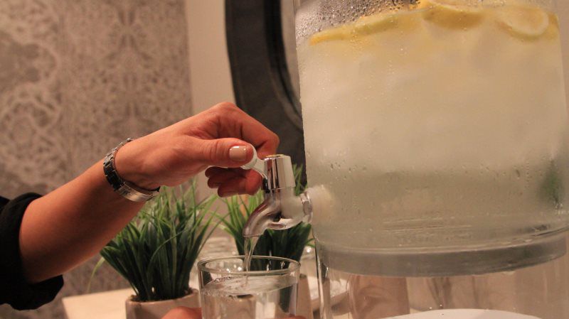 pouring water to a glass