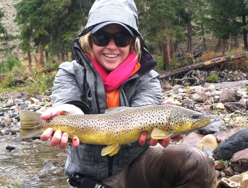 woman holding a fish