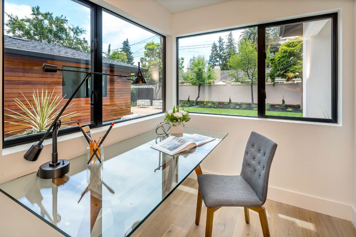 All Weather Aluminum Series 5000 sliding windows allow light and views in this home office