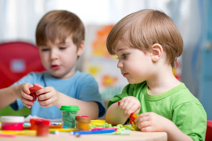 Children playing with play dough