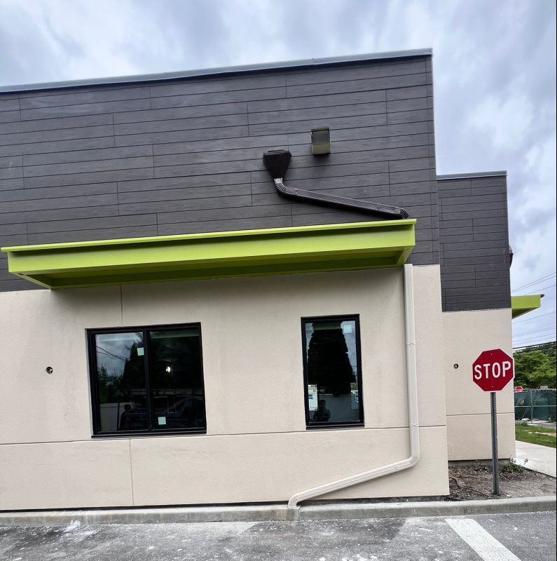 These green and white striped awnings give this home a timeless look while reducing sun exposure. Our custom awnings are popular across Long Island and New Jersey for their style, strength, and efficiency.