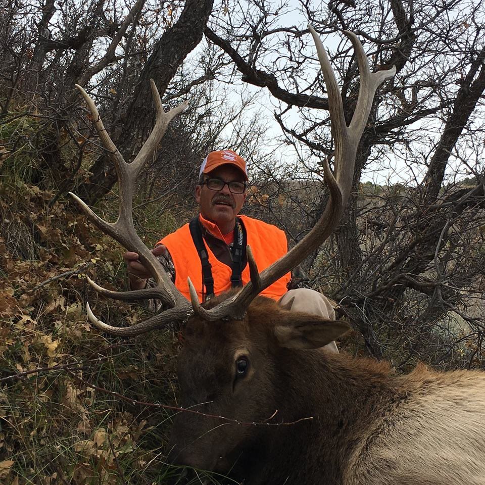 man holding the deer horn knives