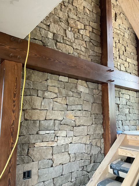 interior stone masonry and timber stairwell