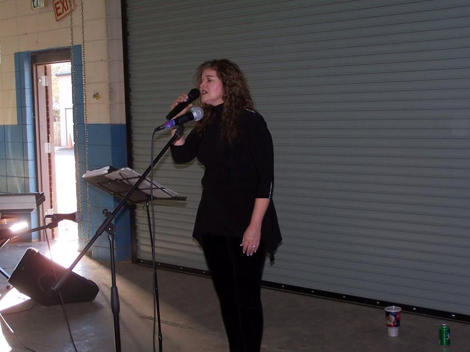 woman holding a microphone