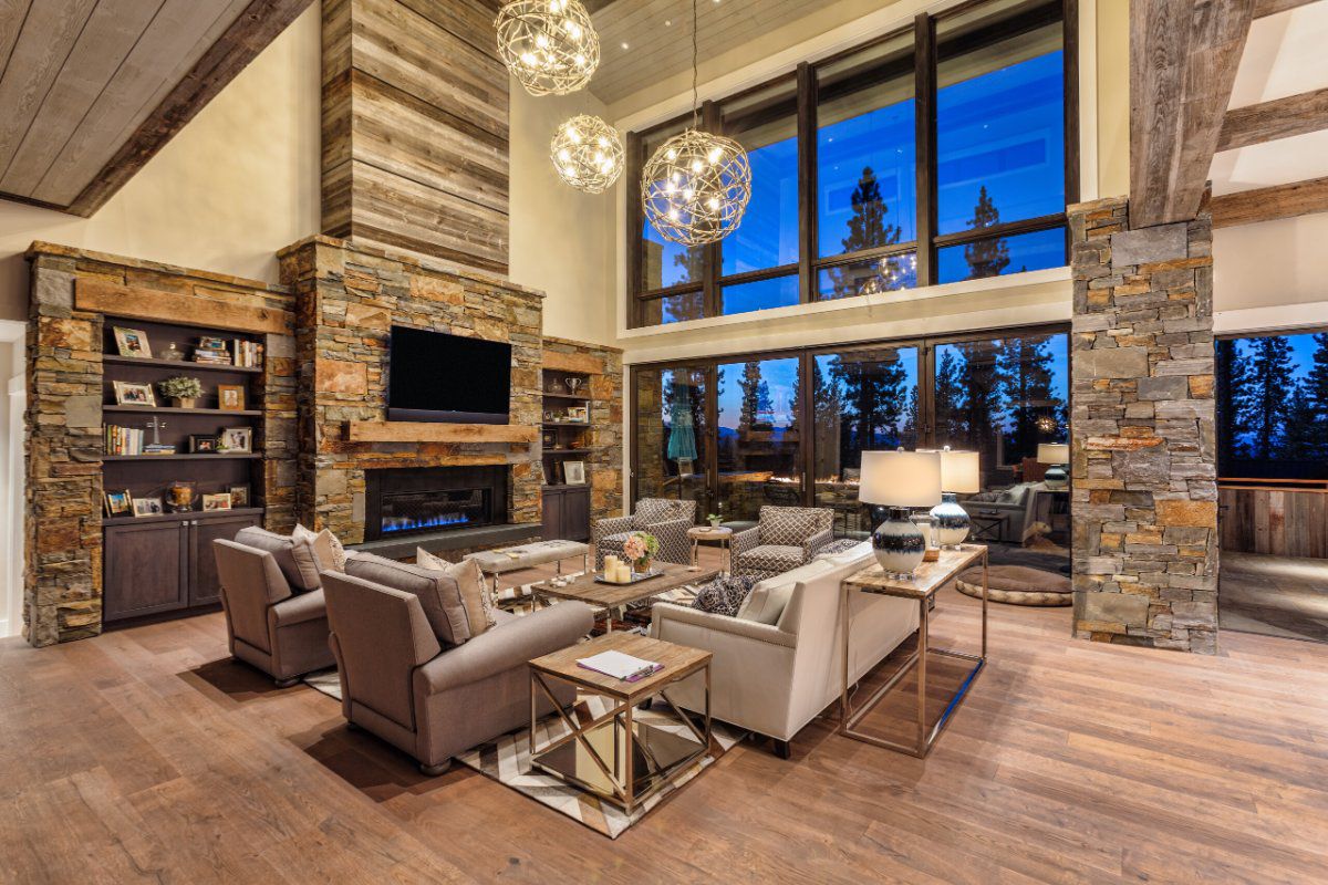 Weather Shield Contemporary Collection aluminum-clad wood floor-to-ceiling windows in a rustic lodge-style great room.