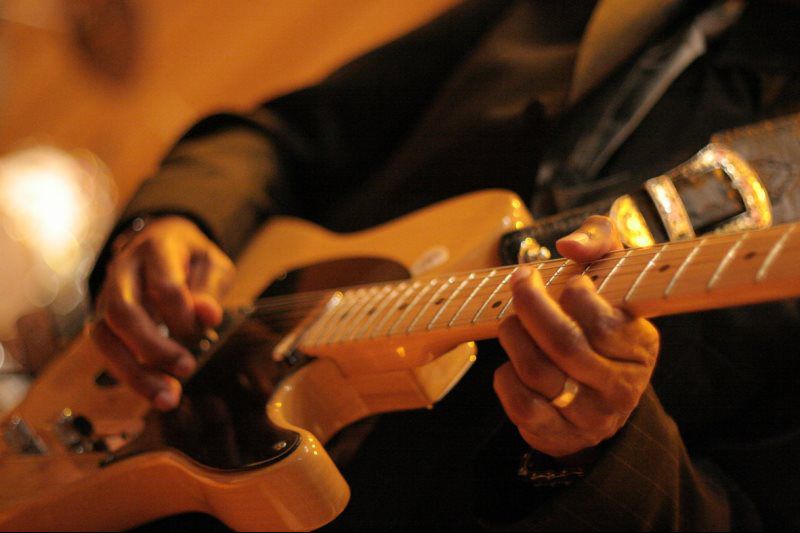 person holding a guitar