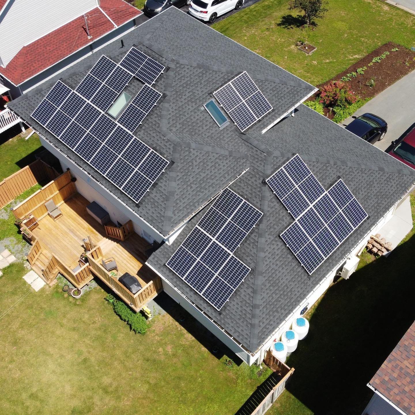Large pitched roof with solar panels and GAF Shingles