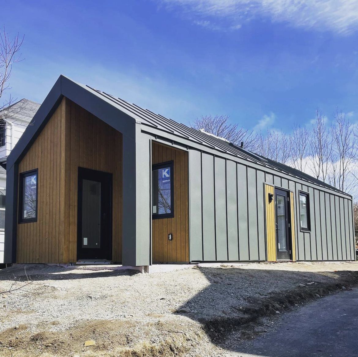 Tiny home with grey metal siding and & roof Halifax NS