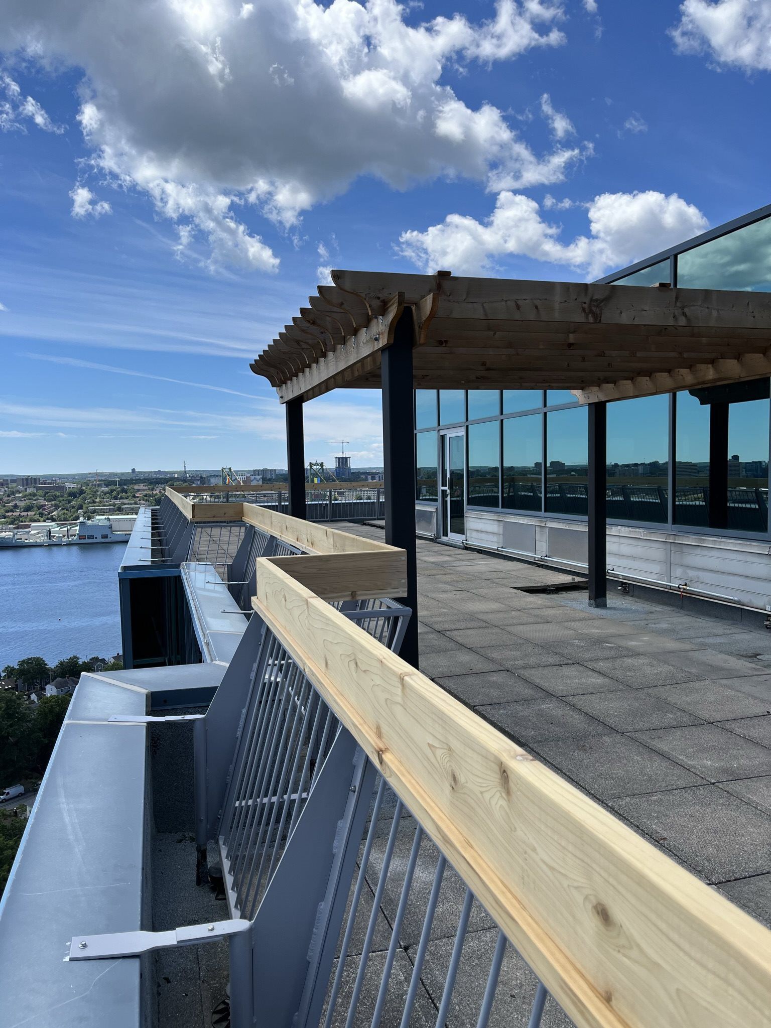 Rooftop Patio installation with safety railings, Soprema roofing products 