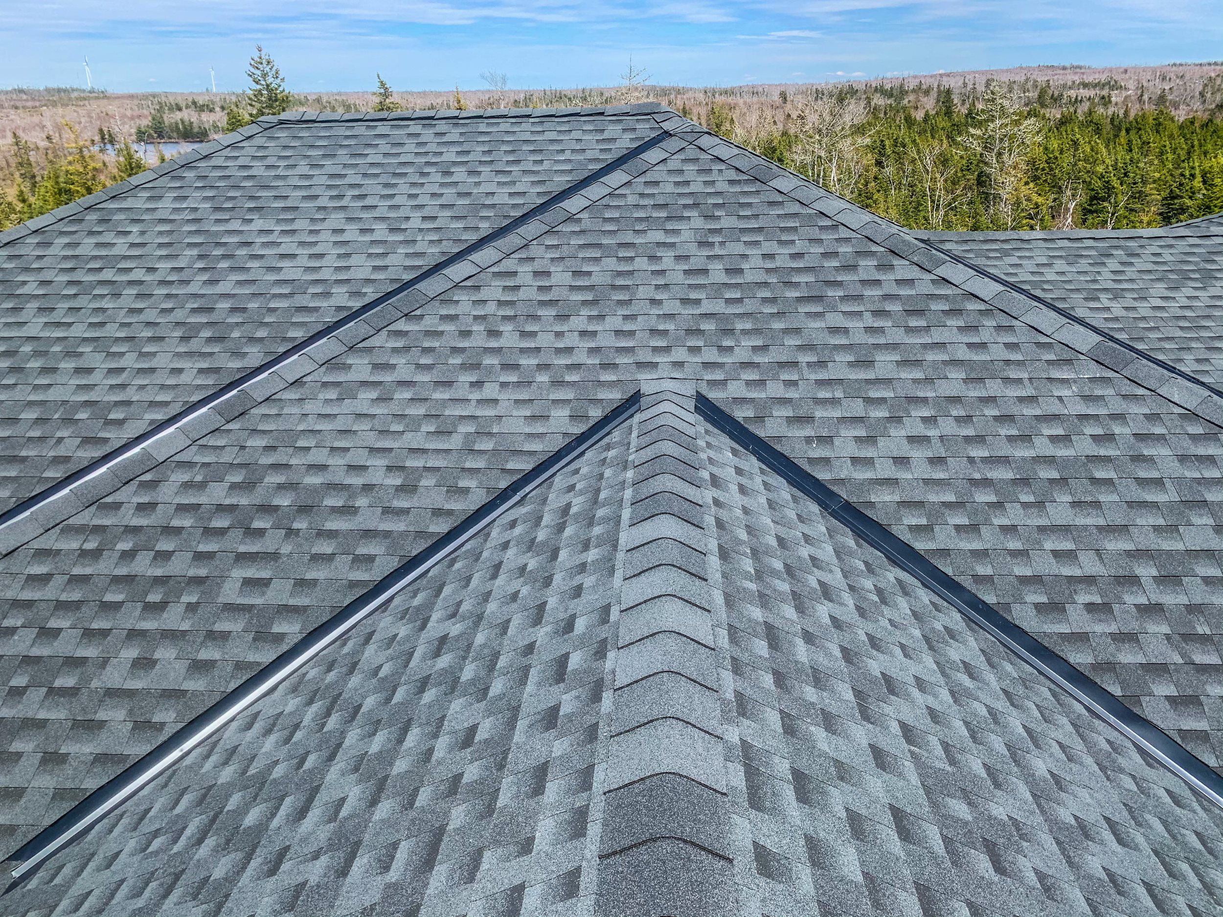 Roofworks Installed a GAF HDZ asphalt shingle with metal roof valleys and Timbertex Cap Shingles