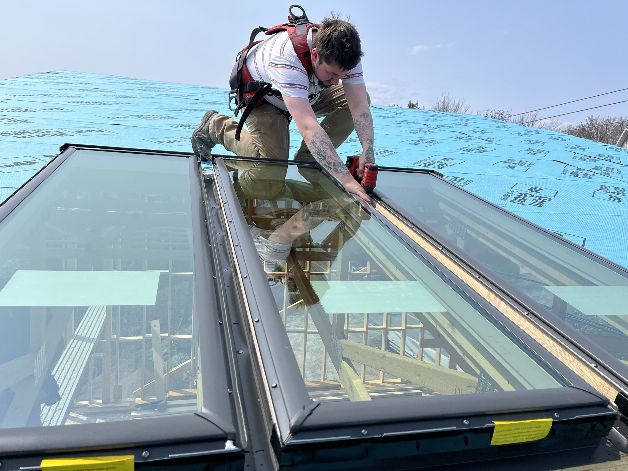 Man installing 3 VELUX Skylights