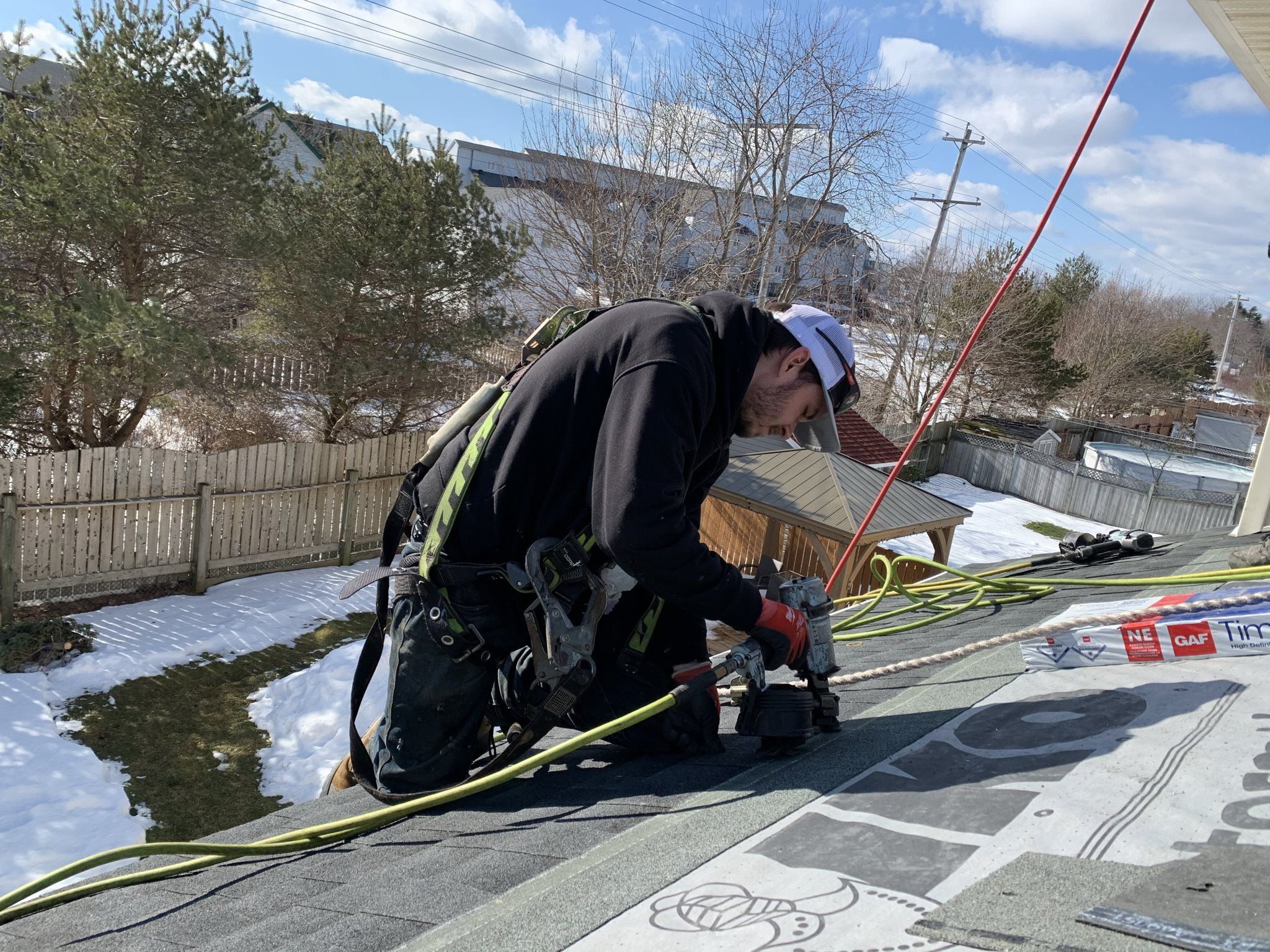 Man installs new GAF asphalt roof