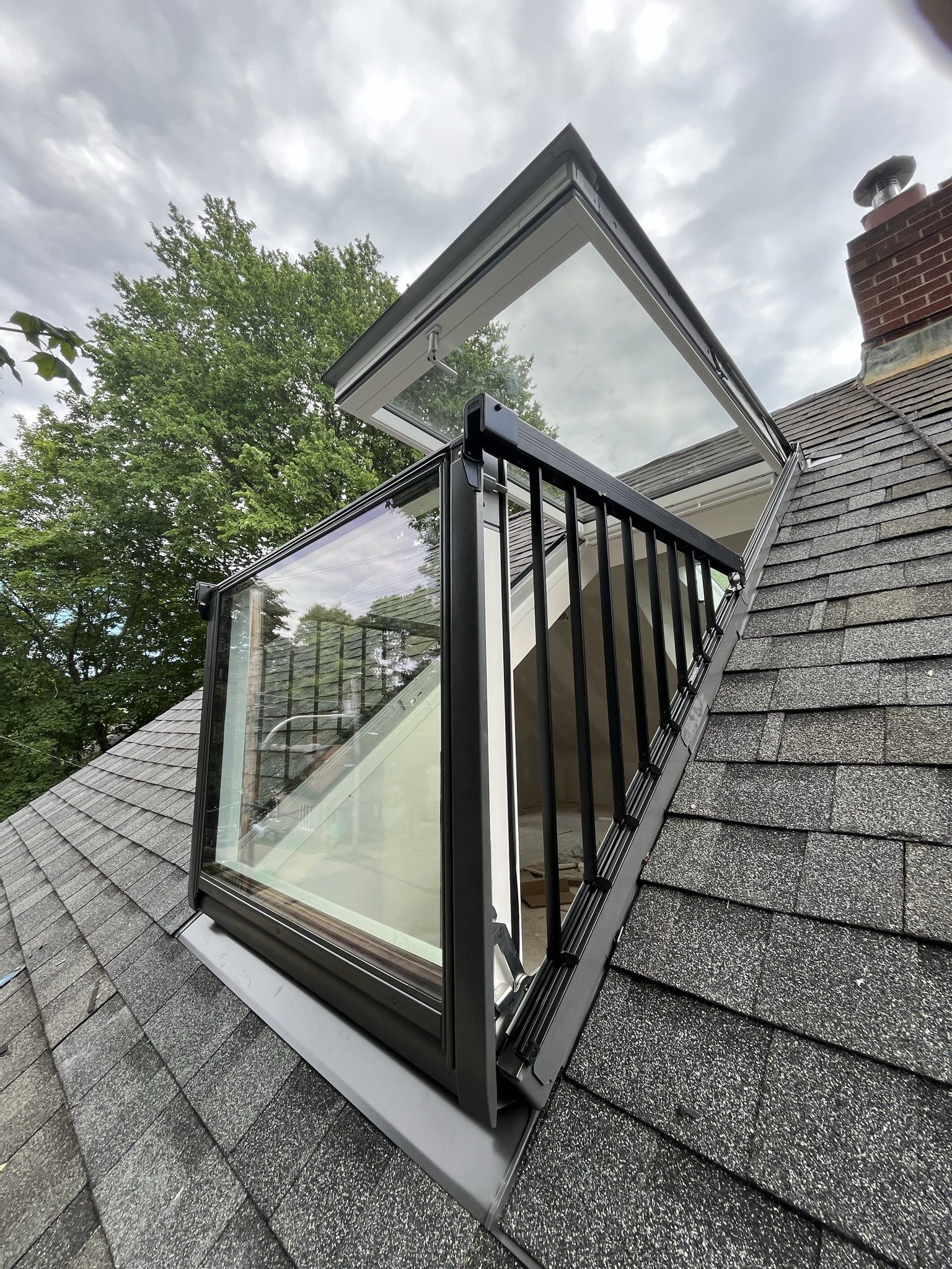 Velux opening rooftop balcony, converts a skylight into a useable space that opens.