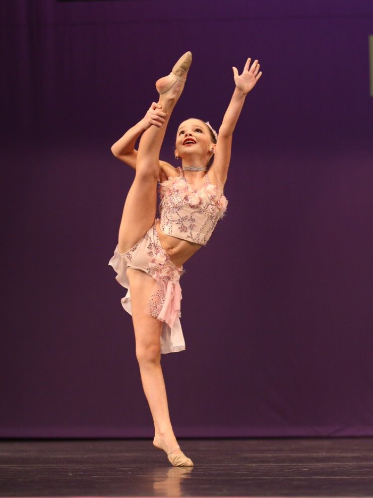 ballet dancer raising her legs