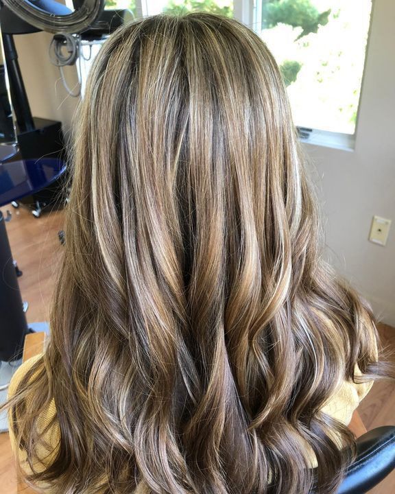 Variations of Honey highlights and lowlights long layers and soft curls by Krisztina