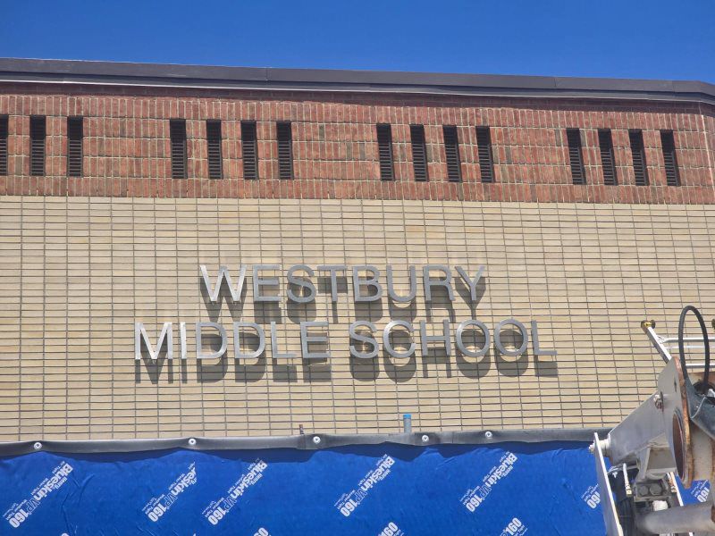 A stylish translucent face channel letter sign with backlit illumination, providing a soft glow for businesses in Mineola, New York. Designed by Awningstar, this sign complements residential awnings near me, garden awnings for sale, and patio awnings