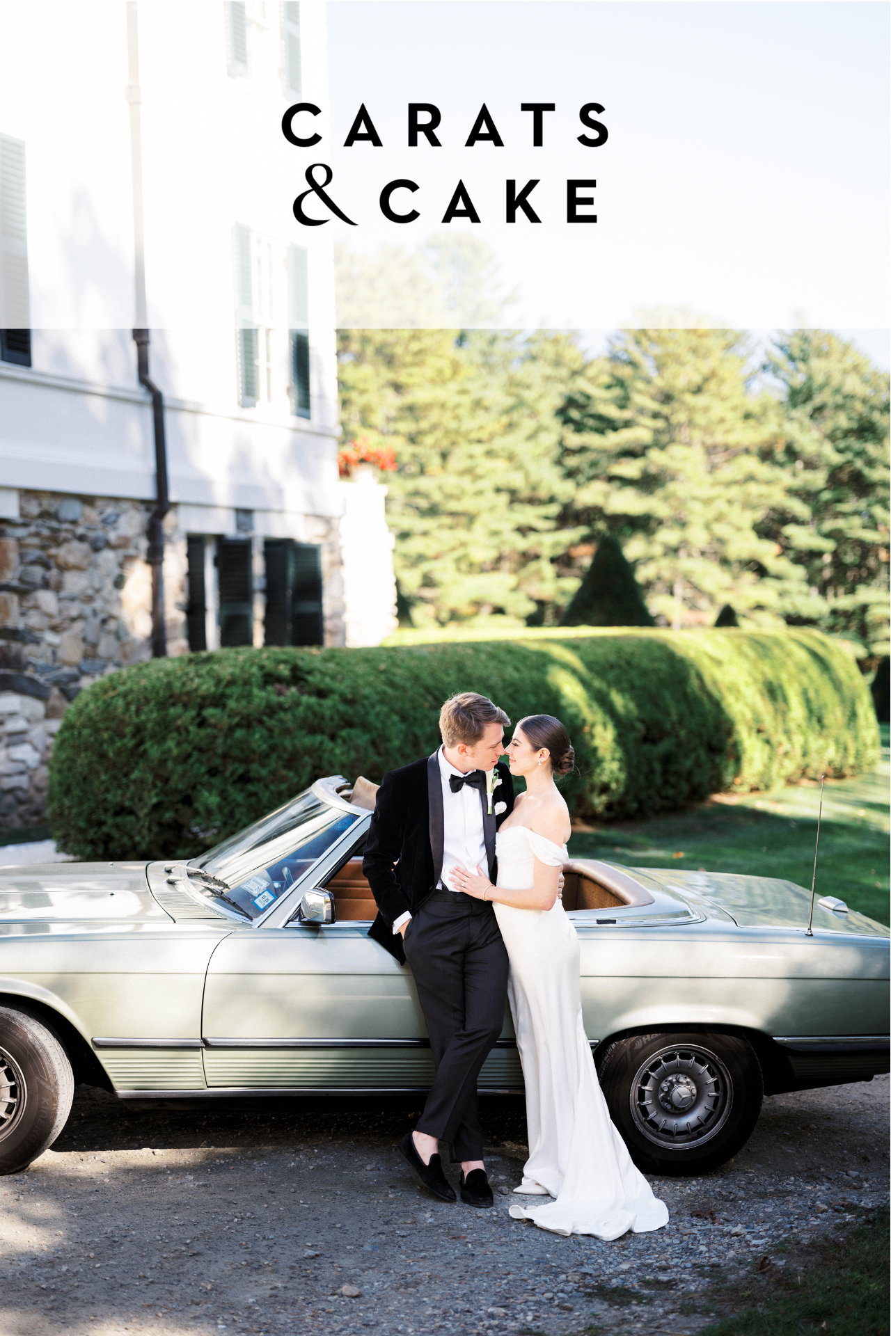 Married couple leaning on car