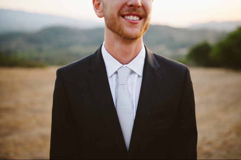 man on suit smiling