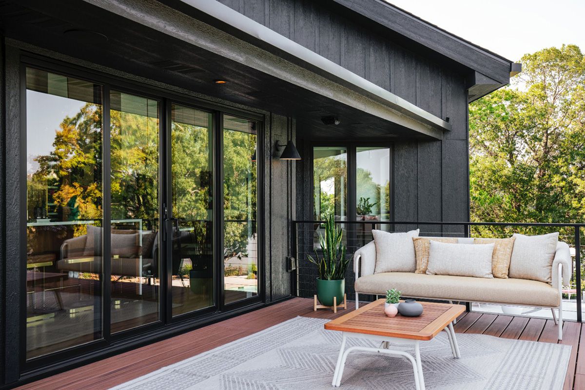 Marvin Elevate Ultrex fiberglass sliding patio door featuring an Ebony exterior frame for a modern look on the outdoor deck