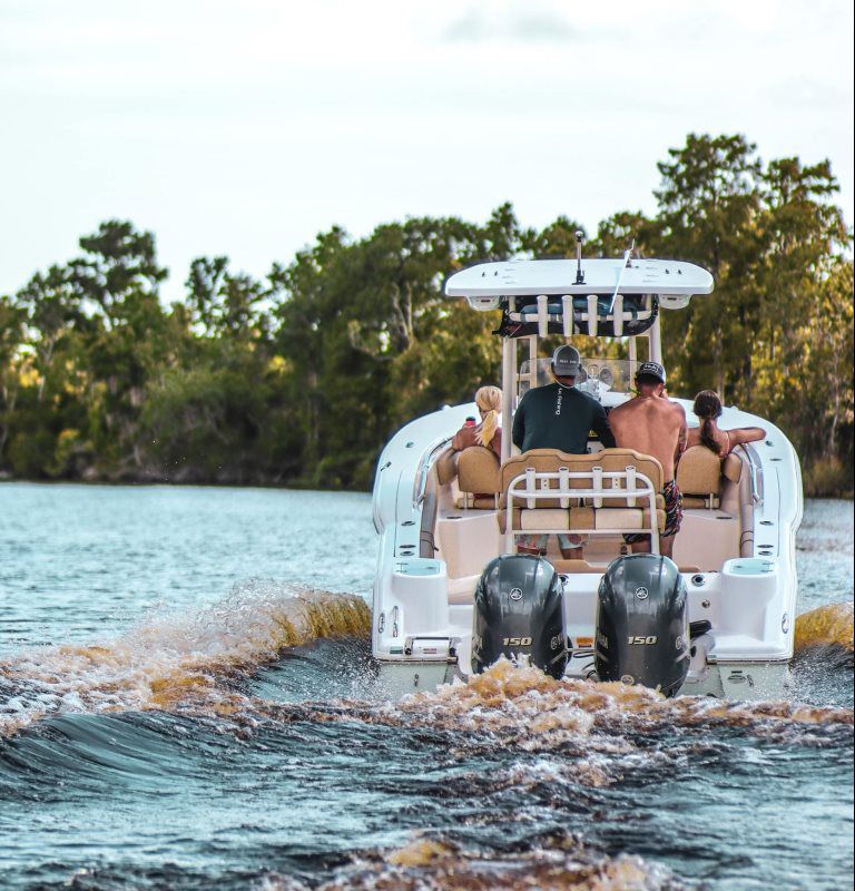 Family in center console boat in Florida