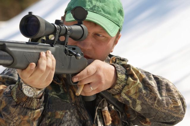 military holding a sniper