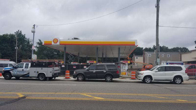 Secure sign installation by Roll Up Awnings, tailored for businesses needing commercial shop awnings, pylon signs, and outdoor shade canopies near you. Our experienced team in Mineola, New York, ensures every sign is installed with precision and care