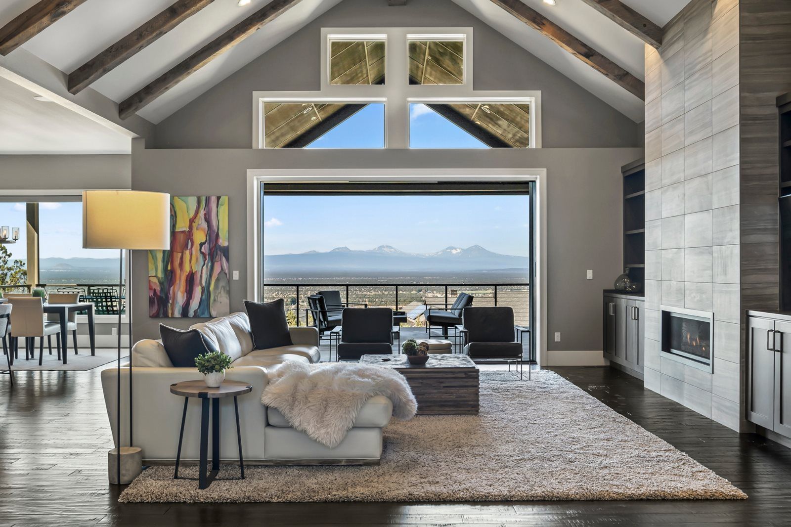 Modern pocket sliding patio doors fully recessed into wall cavity, creating a wide unobstructed opening with seamless indoor-outdoor views
