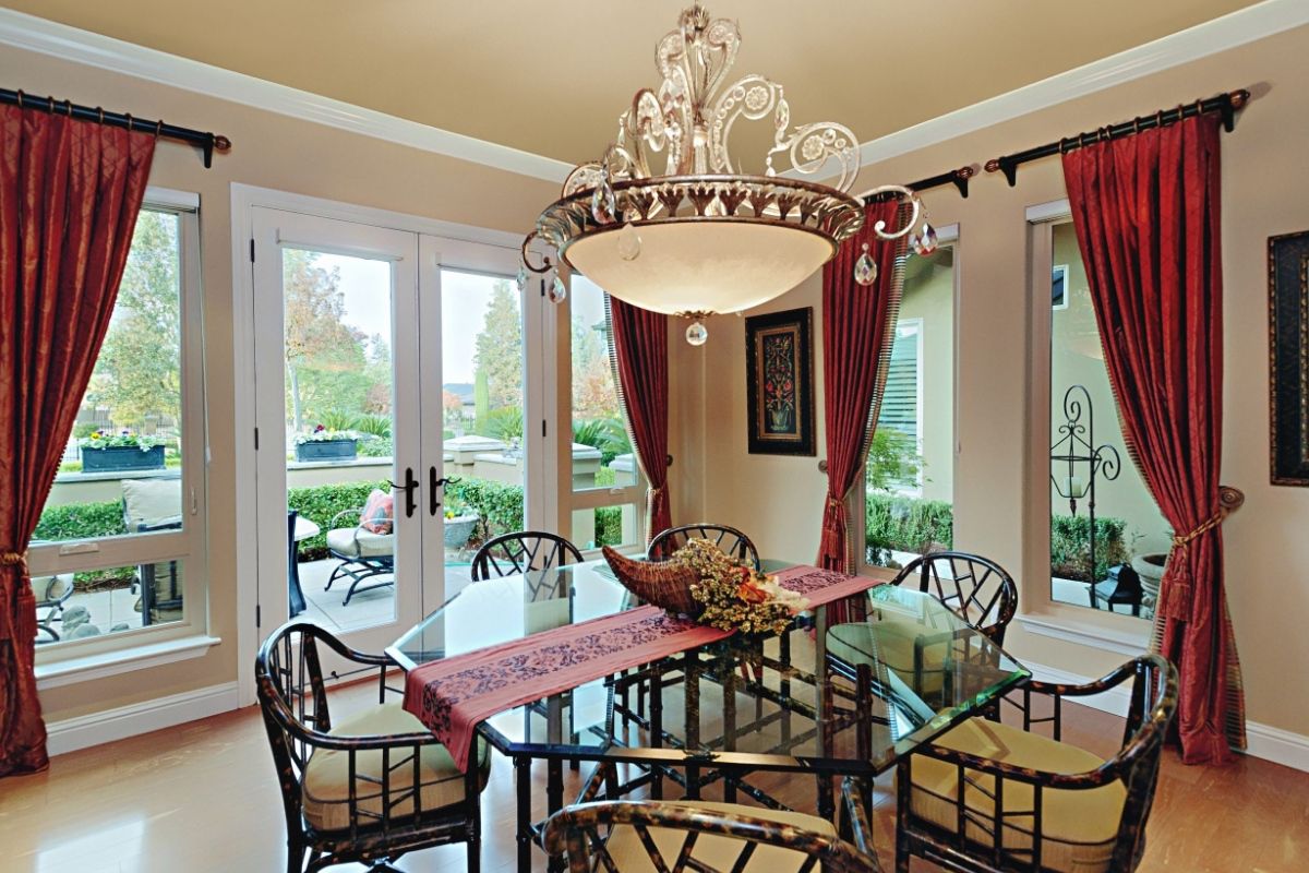 Anlin Cornado series windows and French doors in dining room with red drapes accentuating tall windows