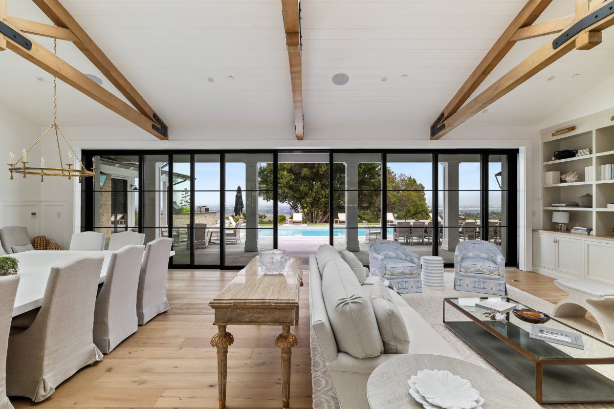 AG Millworks multi-slide glass doors opening to an outdoor patio