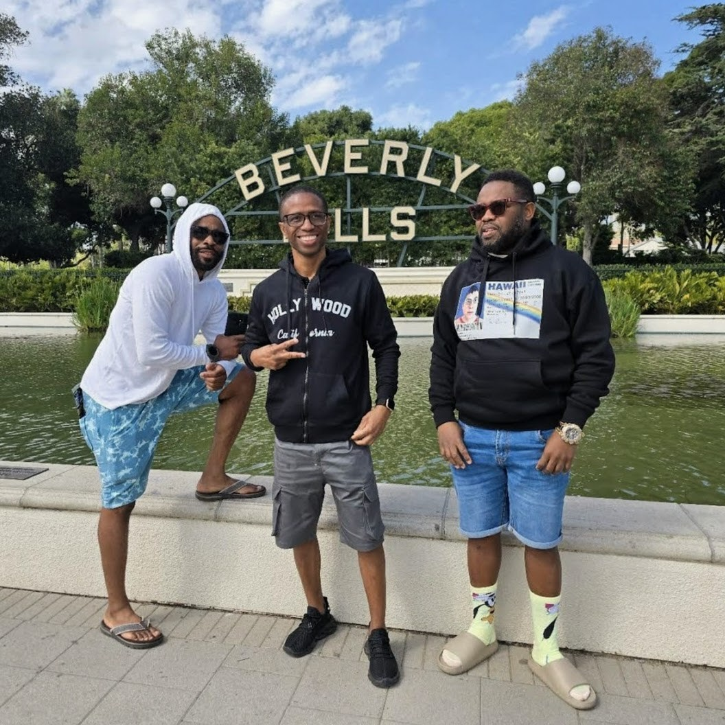 Friends at the Beverly Hills sign on our Hollywood bus tour